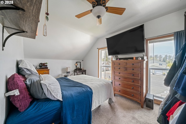 bedroom featuring carpet, a ceiling fan, and lofted ceiling