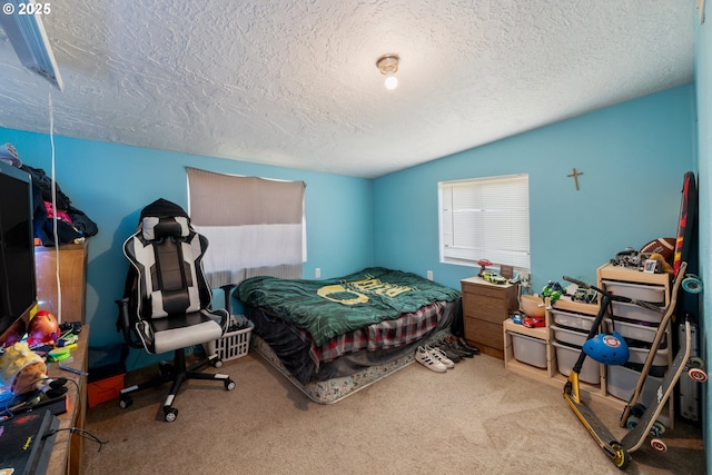 carpeted bedroom with a textured ceiling