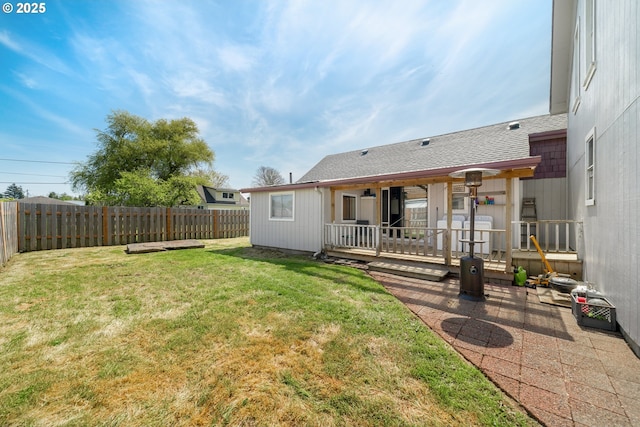 view of yard featuring a fenced backyard and a deck