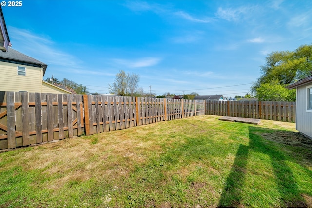 view of yard featuring a fenced backyard