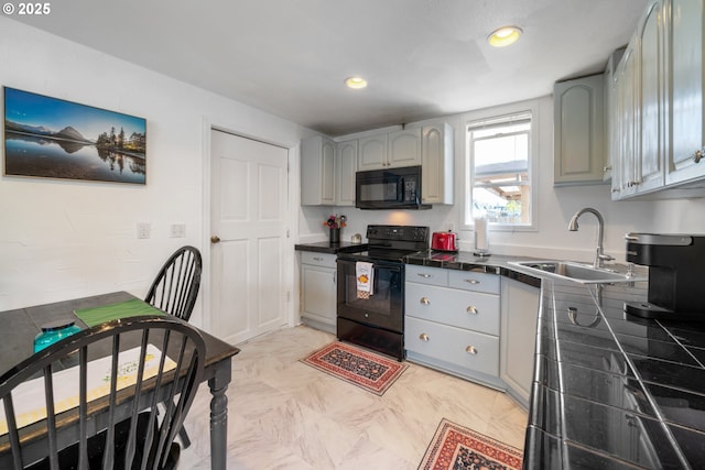 kitchen featuring a sink, gray cabinets, tile countertops, and black appliances