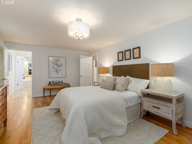 bedroom with light wood-style floors and baseboards