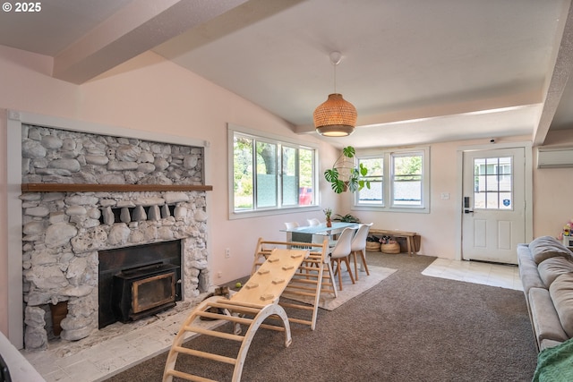 carpeted living room featuring a fireplace, lofted ceiling, and a wall mounted air conditioner
