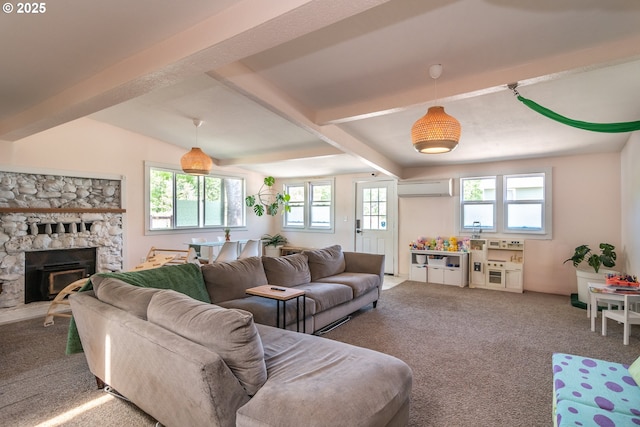 carpeted living room with a wall mounted AC, a stone fireplace, and beam ceiling