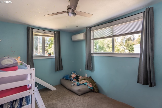 carpeted bedroom with multiple windows, a wall mounted AC, and ceiling fan