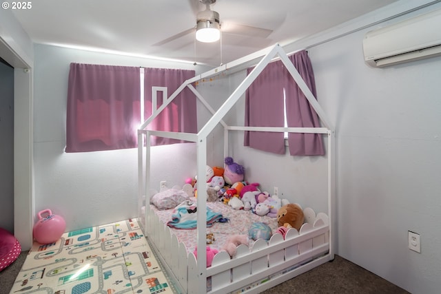 bedroom with ceiling fan and a wall unit AC