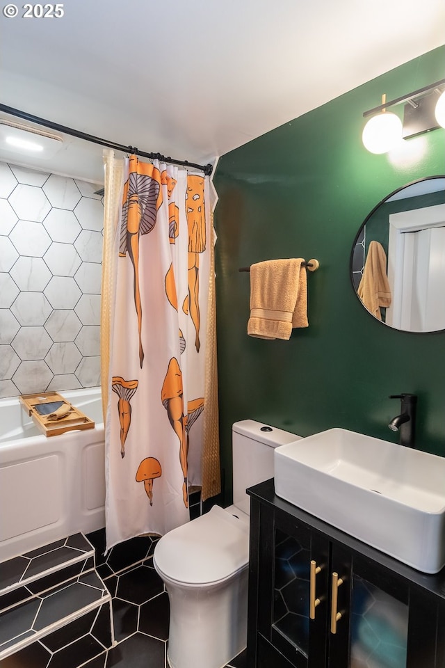 bathroom with toilet, shower / bath combo, and vanity
