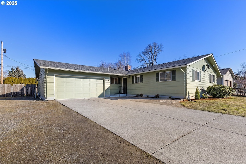 ranch-style house featuring a garage