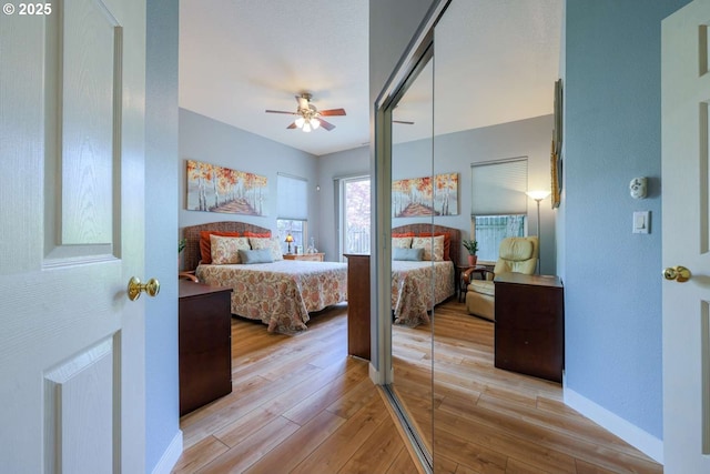 6641 NE Rosebay Dr, Hillsboro, OR 97124 - bedroom with light wood-style floors, baseboards, and ceiling fan