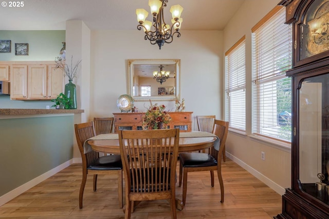 6641 NE Rosebay Dr, Hillsboro, OR 97124 - dining space with a chandelier, light wood finished floors, and baseboards