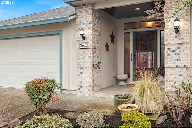 doorway to property with a garage