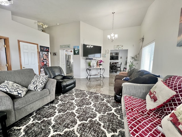 living room with a chandelier and a towering ceiling