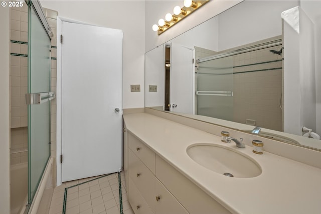 full bathroom featuring tile patterned floors, vanity, and shower / bath combination with glass door