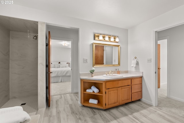 93933 Marcola Rd, Marcola, OR 97454 - full bathroom featuring a marble finish shower, wood finished floors, vanity, and connected bathroom