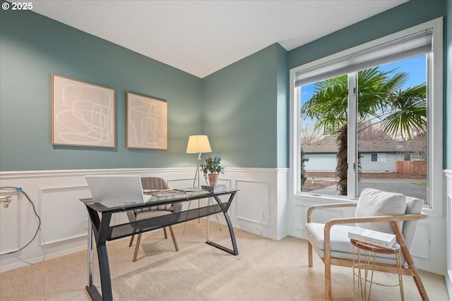 office area with light carpet and wainscoting