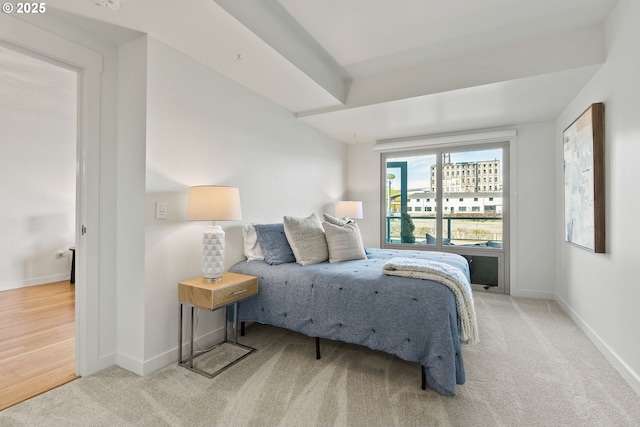 bedroom with carpet floors and baseboards