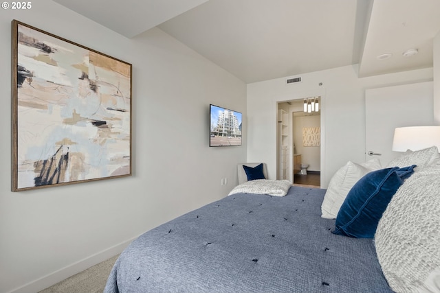 carpeted bedroom with baseboards and visible vents