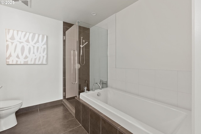 bathroom featuring a garden tub, visible vents, toilet, tile patterned floors, and a tile shower