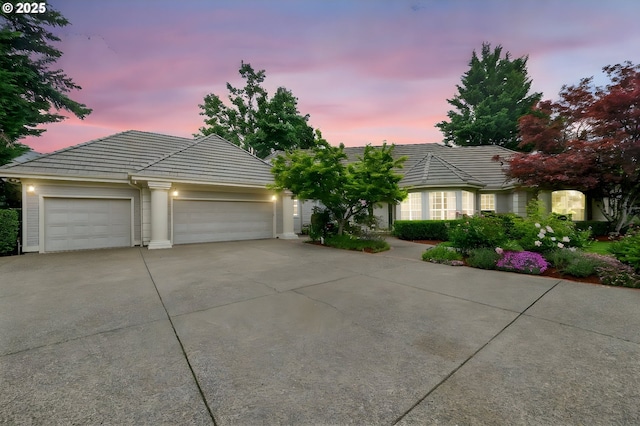 2586 Grand Vista Dr, Springfield, OR 97477 - ranch-style house with concrete driveway, a tiled roof, and an attached garage