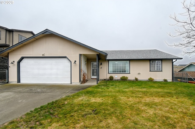 ranch-style home with a garage and a front lawn