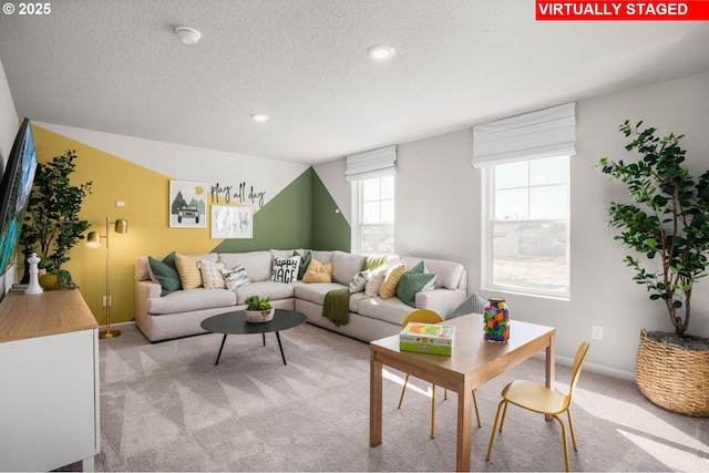 31766 NW Turel Dr, North Plains, OR 97133 - living area with light carpet, a textured ceiling, baseboards, and recessed lighting