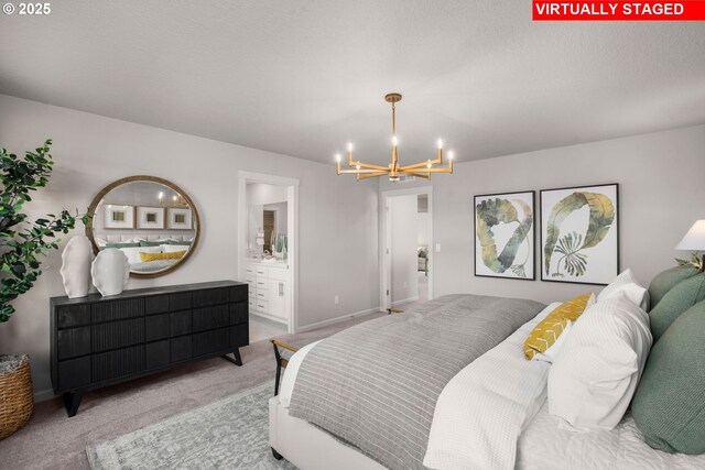 31766 NW Turel Dr, North Plains, OR 97133 - bedroom with a chandelier, carpet floors, baseboards, and ensuite bath