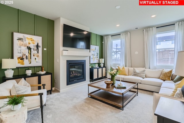 31766 NW Turel Dr, North Plains, OR 97133 - living area featuring a glass covered fireplace, recessed lighting, and light carpet