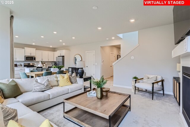 31766 NW Turel Dr, North Plains, OR 97133 - living area featuring recessed lighting, light carpet, and baseboards