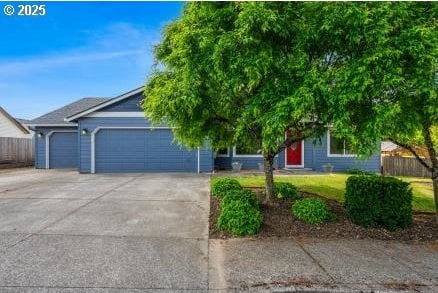815 NW 24th St, Battle Ground, WA 98604 - obstructed view of property with driveway and an attached garage