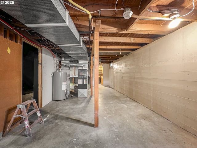 unfinished below grade area featuring gas water heater and heating unit