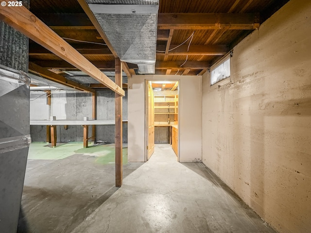 unfinished basement with heating unit