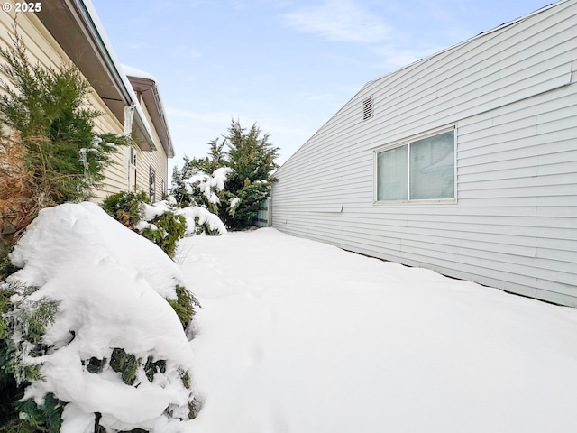 view of yard covered in snow