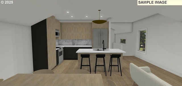 kitchen featuring range with electric cooktop, a center island, refrigerator, pendant lighting, and decorative backsplash