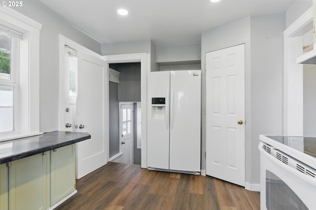 229 Cc St, Woodland, WA 98674 - kitchen with white appliances, dark wood-style floors, recessed lighting, and dark countertops