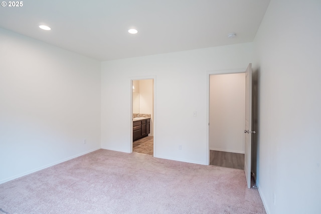 1067 S 55th St, Springfield, OR 97478 - unfurnished bedroom featuring light colored carpet, recessed lighting, and ensuite bathroom