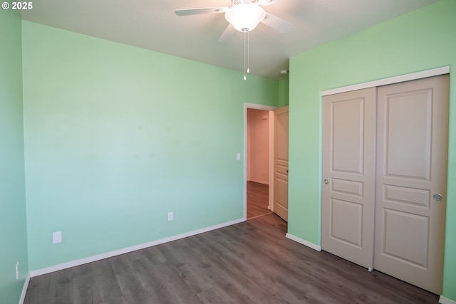 1067 S 55th St, Springfield, OR 97478 - unfurnished bedroom featuring wood finished floors, a closet, and a ceiling fan