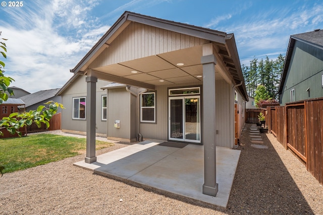 1067 S 55th St, Springfield, OR 97478 - rear view of property featuring a fenced backyard and a patio area