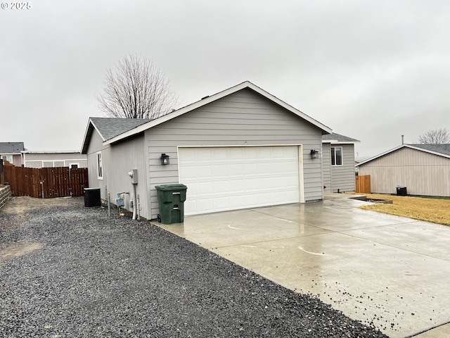 view of side of home featuring a garage