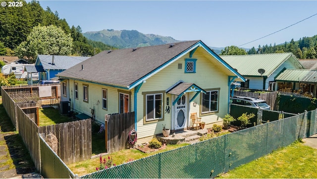 380 3rd Ave, Powers, OR 97466 - bungalow featuring central AC, a mountain view, and a fenced backyard