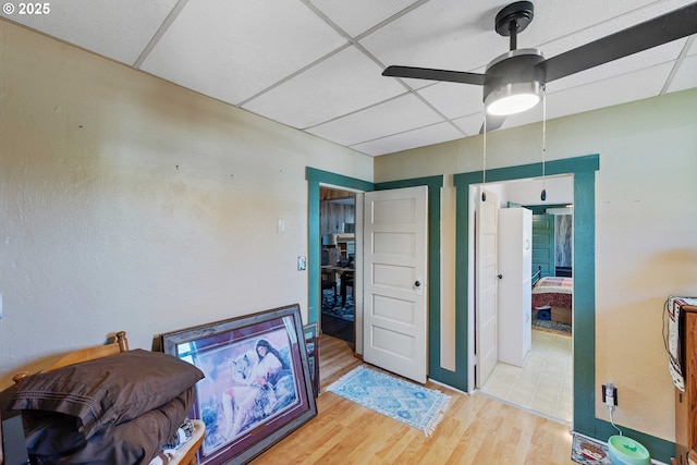 380 3rd Ave, Powers, OR 97466 - bedroom with wood finished floors, a paneled ceiling, and ceiling fan