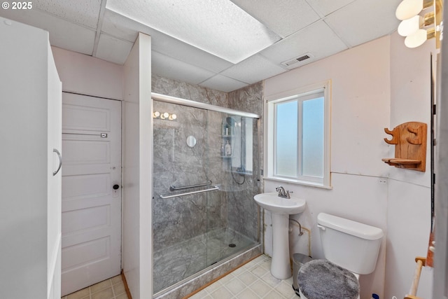 380 3rd Ave, Powers, OR 97466 - bathroom with toilet, a shower stall, and tile patterned flooring