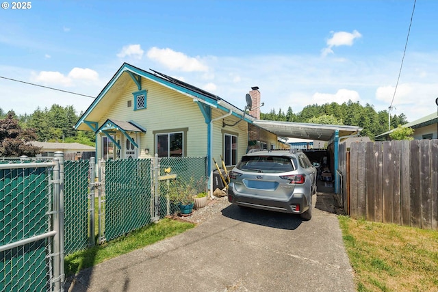 380 3rd Ave, Powers, OR 97466 - view of front of house featuring a chimney and driveway
