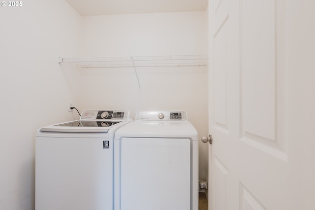 washroom featuring washing machine and dryer