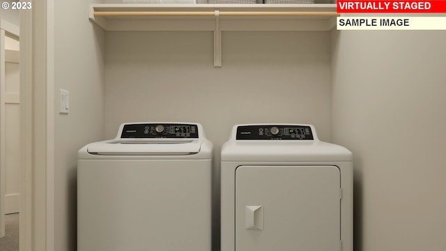 laundry room featuring washing machine and dryer