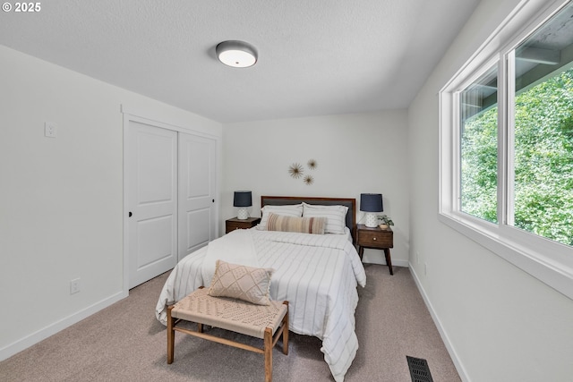 37465 Dubarko Rd, Sandy, OR 97055 - carpeted bedroom with a closet and a textured ceiling