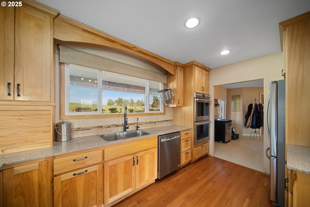 4664 N Mckay Rd, Prineville, OR 97754 - kitchen with appliances with stainless steel finishes, a sink, wood finished floors, recessed lighting, and light stone countertops