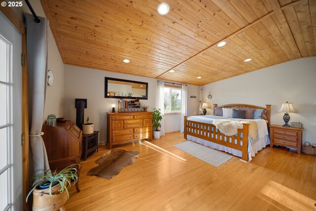 4664 N Mckay Rd, Prineville, OR 97754 - bedroom featuring a wood stove, wooden ceiling, hardwood / wood-style floors, and recessed lighting