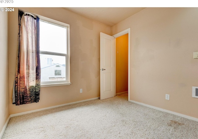 spare room featuring carpet