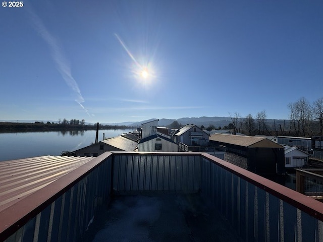 exterior space with a water view