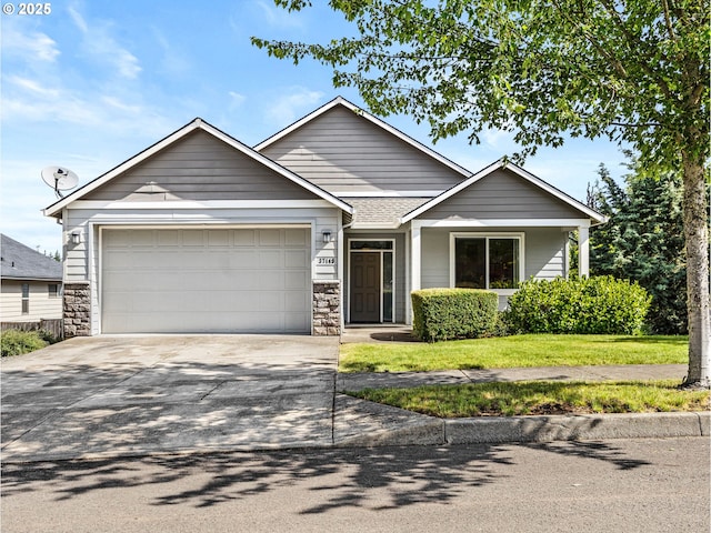 37149 Emerald Cascade, Sandy, OR 97055 - view of front of home featuring an attached garage, driveway, stone siding, and a front yard